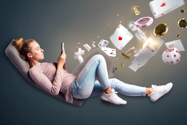 A player using their smartphone during a festive local event, representing R6R6’s fully mobile-friendly casino.